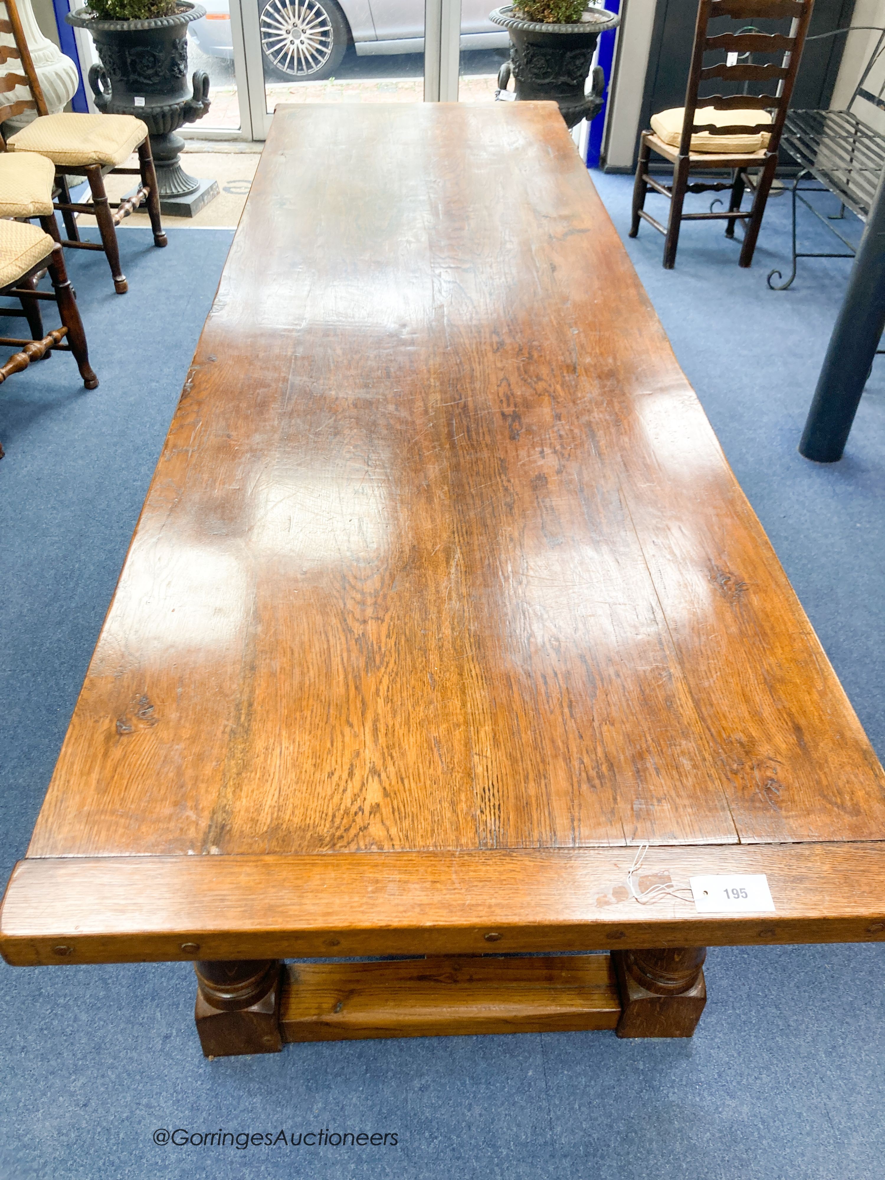 An 18th century style rectangular oak refectory dining table, length 274cm, depth 85cm, height 78cm